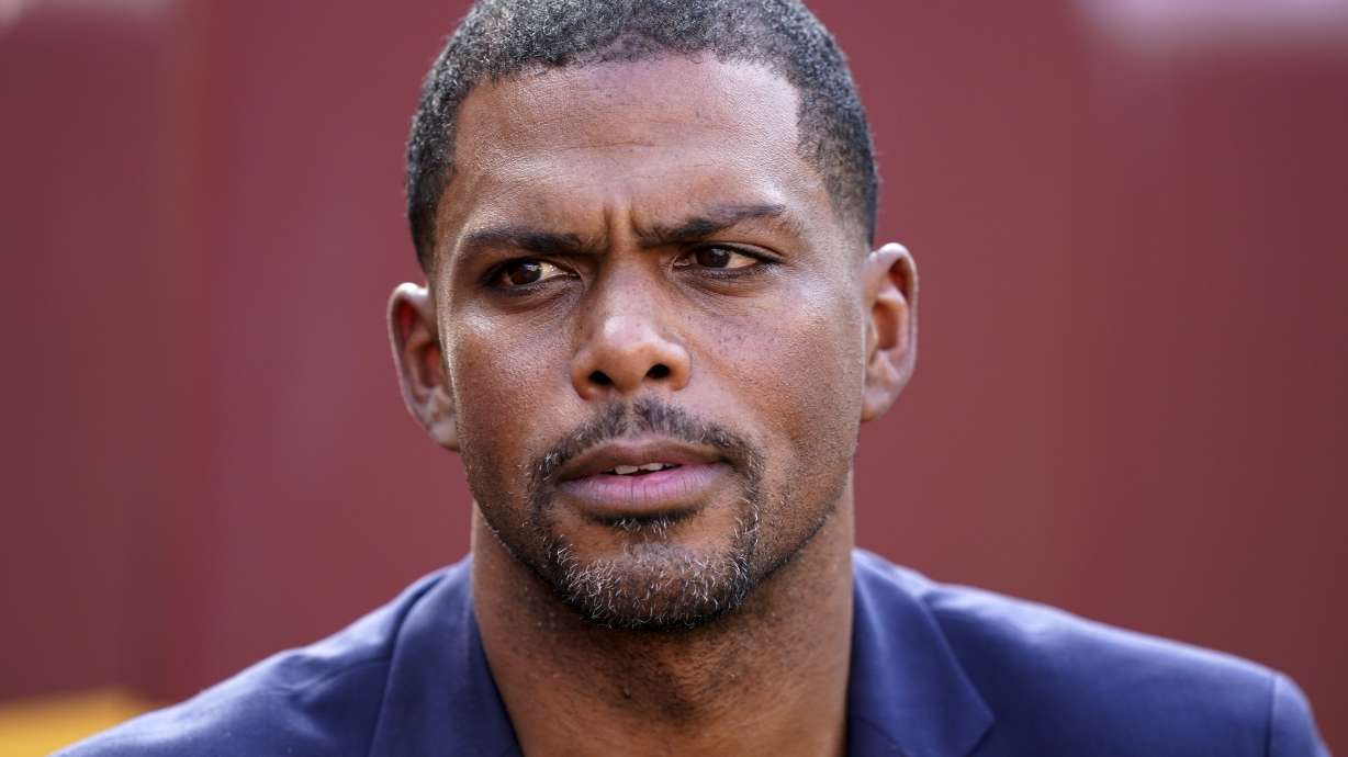 FILE - Washington Commanders team president Jason Wright pauses while speaking during an interview before an NFL football practice at FedEx Field, Aug. 6, 2022, in Landover, Md. Wright is no longer president of the Washington Commanders and is expected to leave the organization after the 2024 season, a team spokesperson confirmed.