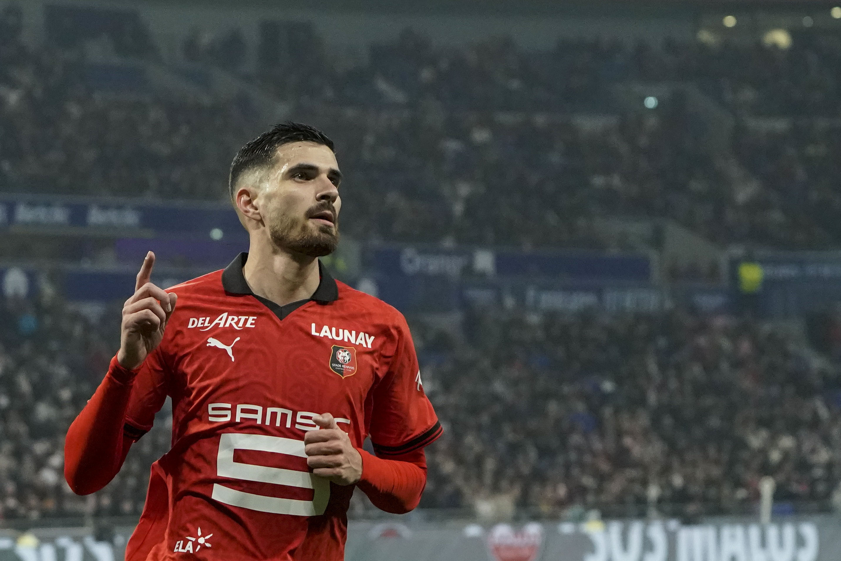 FILE - Rennes' Martin Terrier celebrates after scoring his side's opening goal during the French League One soccer match between Lyon and Rennes at the Groupama stadium, outside Lyon, France, Friday, Jan. 26, 2024. Bayer Leverkusen has signed French forward Martin Terrier from Stade Rennes. The German champion says the 27-year-old Terrier signed a contract through June 2029.