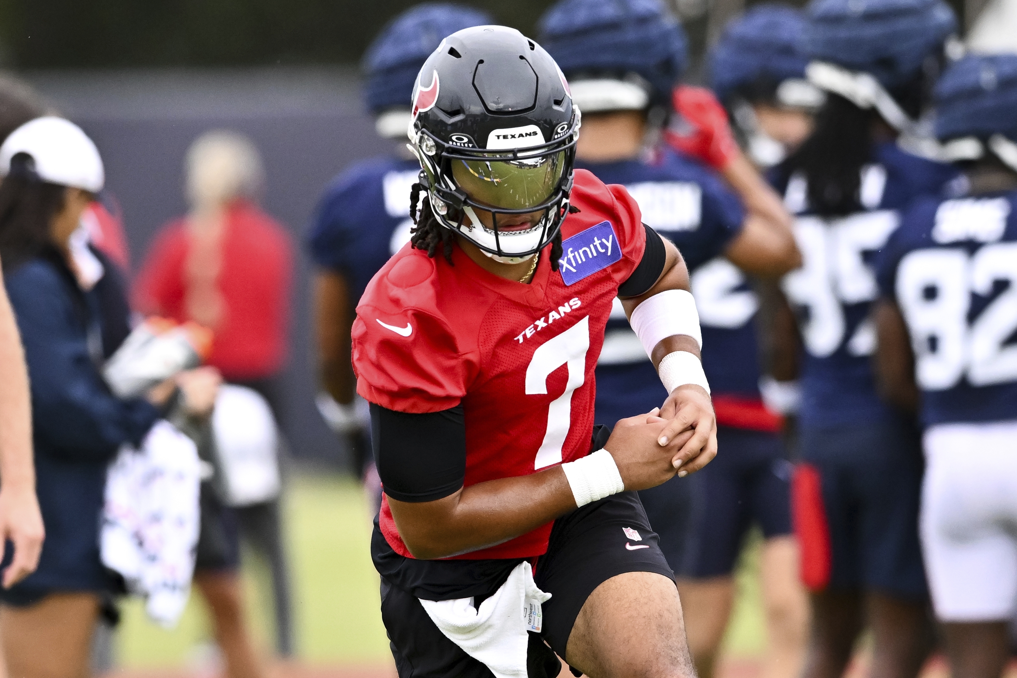 Houston Texans quarterback C.J. Stroud (7) runs a play during NFL football training camp, Thursday, July 18, 2024, Houston.