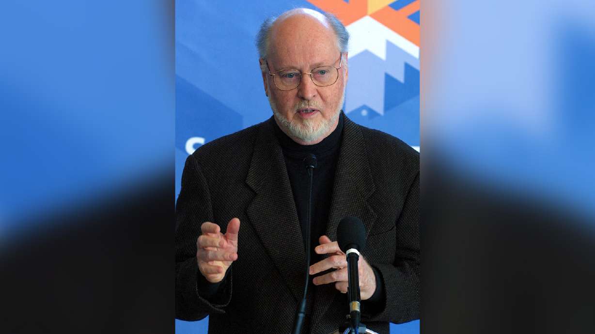Composer John Williams speaks at a 2002 Winter Olympics preview event in 2001. Williams penned a letter supporting efforts to preserve Abravanel Hall in Salt Lake City.