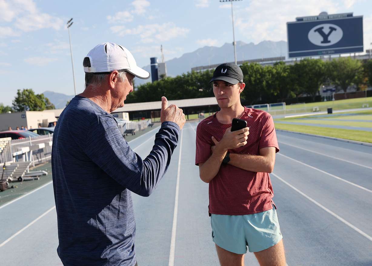 BYU steeplechaser and Olympic-bound Kenneth Rooks talks with coach Ed Eyestone prior to working out in Provo on Thursday, July 11, 2024.