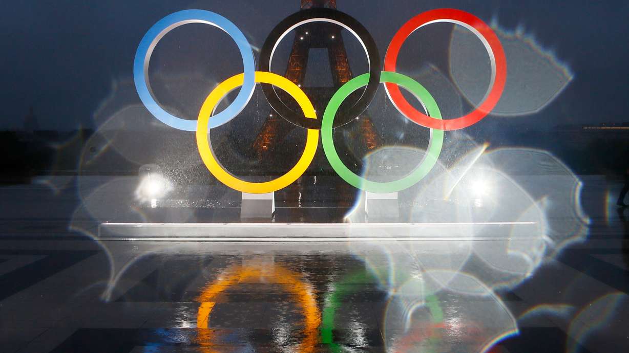 The reflection of the Olympic rings on Trocadero plaza that overlooks the Eiffel Tower in Paris, France, Sept. 13, 2017. The IOC has said it might delay a final award of the 2030 Winter Olympics to France.