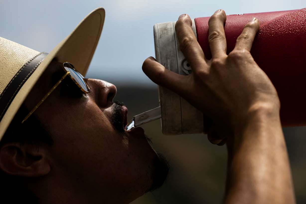 A hiker drinks water near the Potato Hill Trailhead of Corner Canyon in Draper on Thursday.