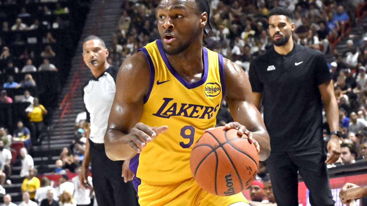 Los Angeles Laker guard Bronny James Jr. (9) drives the ball against the Houston Rockets during the first half of an NBA summer league basketball game Friday, July 12, 2024, in Las Vegas.