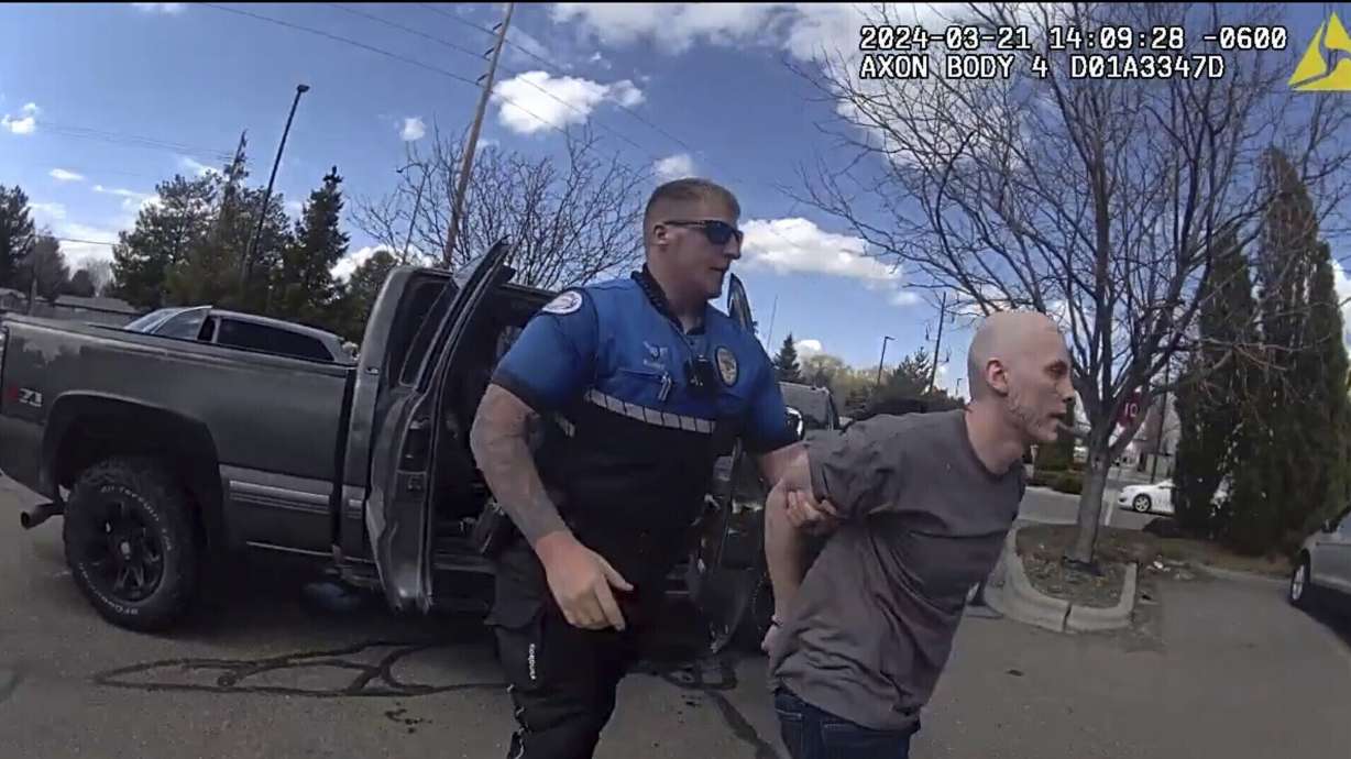 In this photo made from body camera footage and released by the Twin Falls, Idaho, Police Department, Skylar Meade, right, is arrested in Twin Falls on March 21. The inmate received a life sentence Friday for escaping custody.