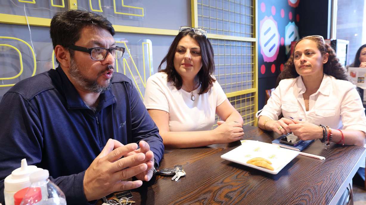 Jose Morales, Mayra Molina and Norely Lopez talk about the Venezuelan presidential elections in Draper on Wednesday. The Venezuelan community in Utah is paying close attention as July 28 presidential elections loom in Venezuela.