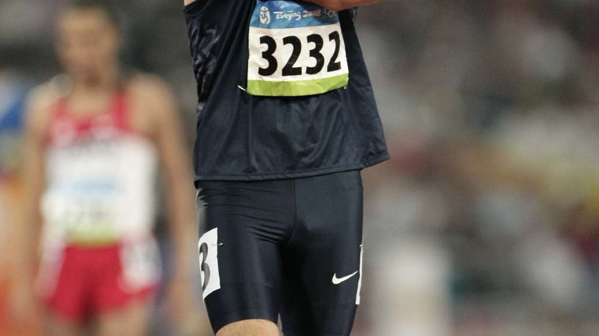 FILE - United States' Christian Smith prepares for a men's 800-meter heat during the athletics competitions in the National Stadium at the Beijing 2008 Olympics in Beijing, Wednesday, Aug. 20, 2008. In the 800-meter final at the 2008 U.S. track trials, Smith dove across the finish line to finish third. That .06-second gap between him and fourth place meant he would, from that moment forward, forever be known as an Olympian.