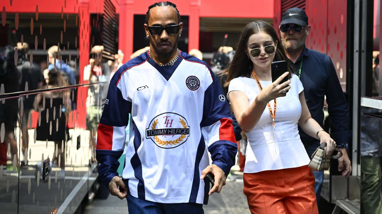 Mercedes driver Lewis Hamilton of Britain walks through the paddock before the first free practice ahead of the Hungarian Formula One Grand Prix race at the Hungaroring racetrack, in Mogyorod, Hungary, Friday, July 19, 2024.