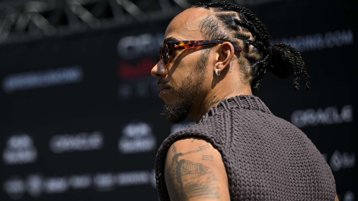 British Formula One driver Lewis Hamilton of Mercedes arrives in the paddock ahead of the Hungarian Formula One Grand Prix at the Hungaroring racetrack in Mogyorod, near Budapest, Hungary, Thursday, July 18, 2024. The Hungarian F1 Grand Prix is held on Sunday, July 21, 2024.