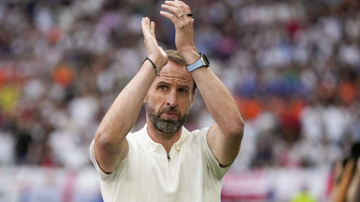 FILE - England coach Gareth Southgate applauds during a round of sixteen match between England and Slovakia at the Euro 2024 soccer tournament in Gelsenkirchen, Germany, Sunday, June 30, 2024. Gareth Southgate announces he will step down as England manager.