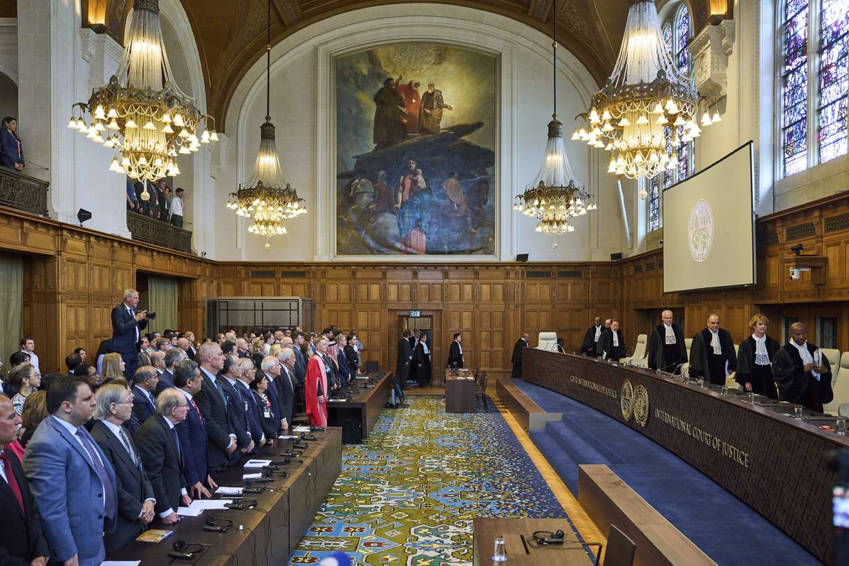 The judges enter the International Court of Justice, or World Court, in The Hague, Netherlands, Friday. The United Nations top court delivered a nonbinding advisory opinion Friday ruling Israel's 57-year occupation of lands sought for a Palestinian state is illegal and should end.