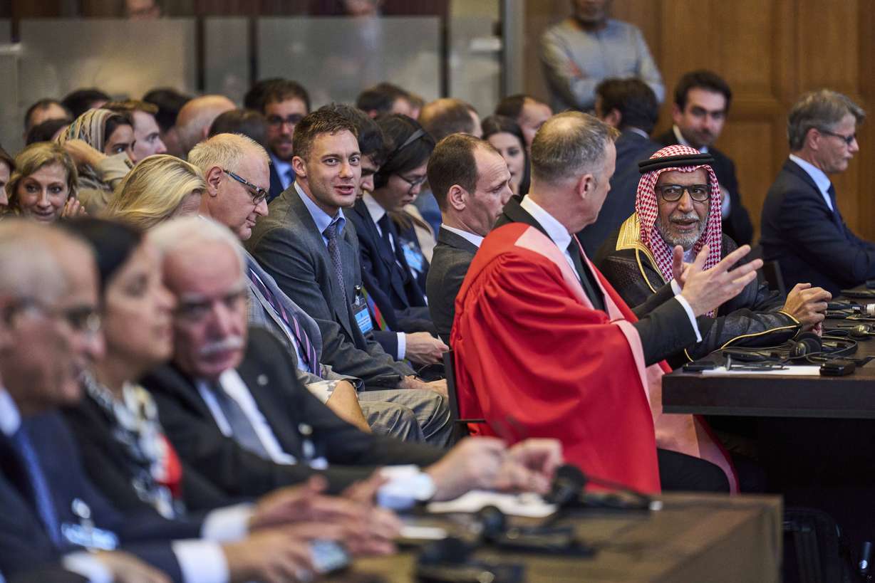 Journalists take images of Israel's legal team, before judges enter the International Court of Justice, or World Court, in The Hague, Netherlands, Friday. The United Nations top court delivered a nonbinding advisory opinion Friday saying Israel's 57-year occupation of lands sought for a Palestinian state is illegal.