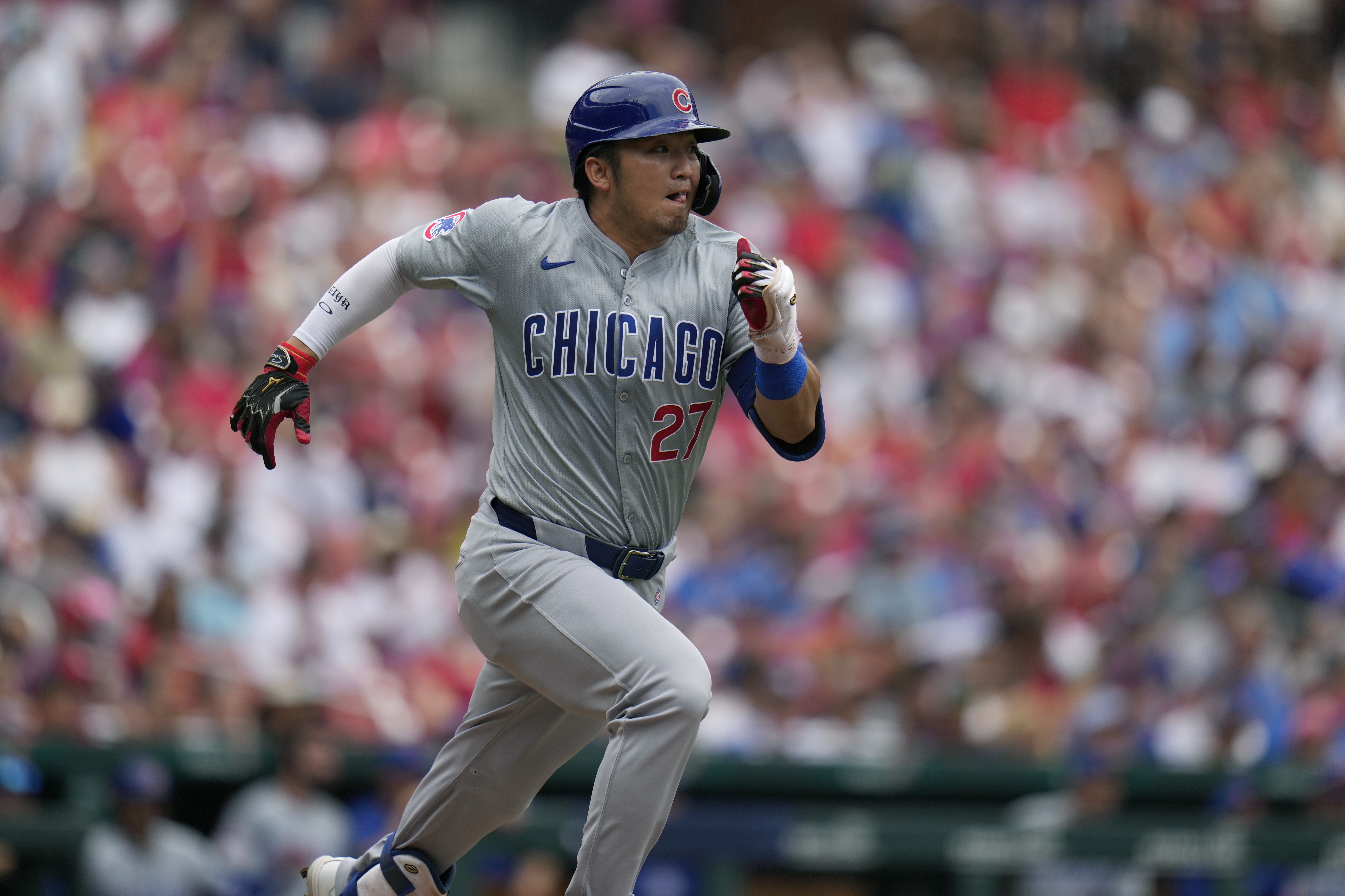 Chicago Cubs' Seiya Suzuki heads to first on an RBI single during the third inning of a baseball game against the St. Louis Cardinals Sunday, July 14, 2024, in St. Louis. 