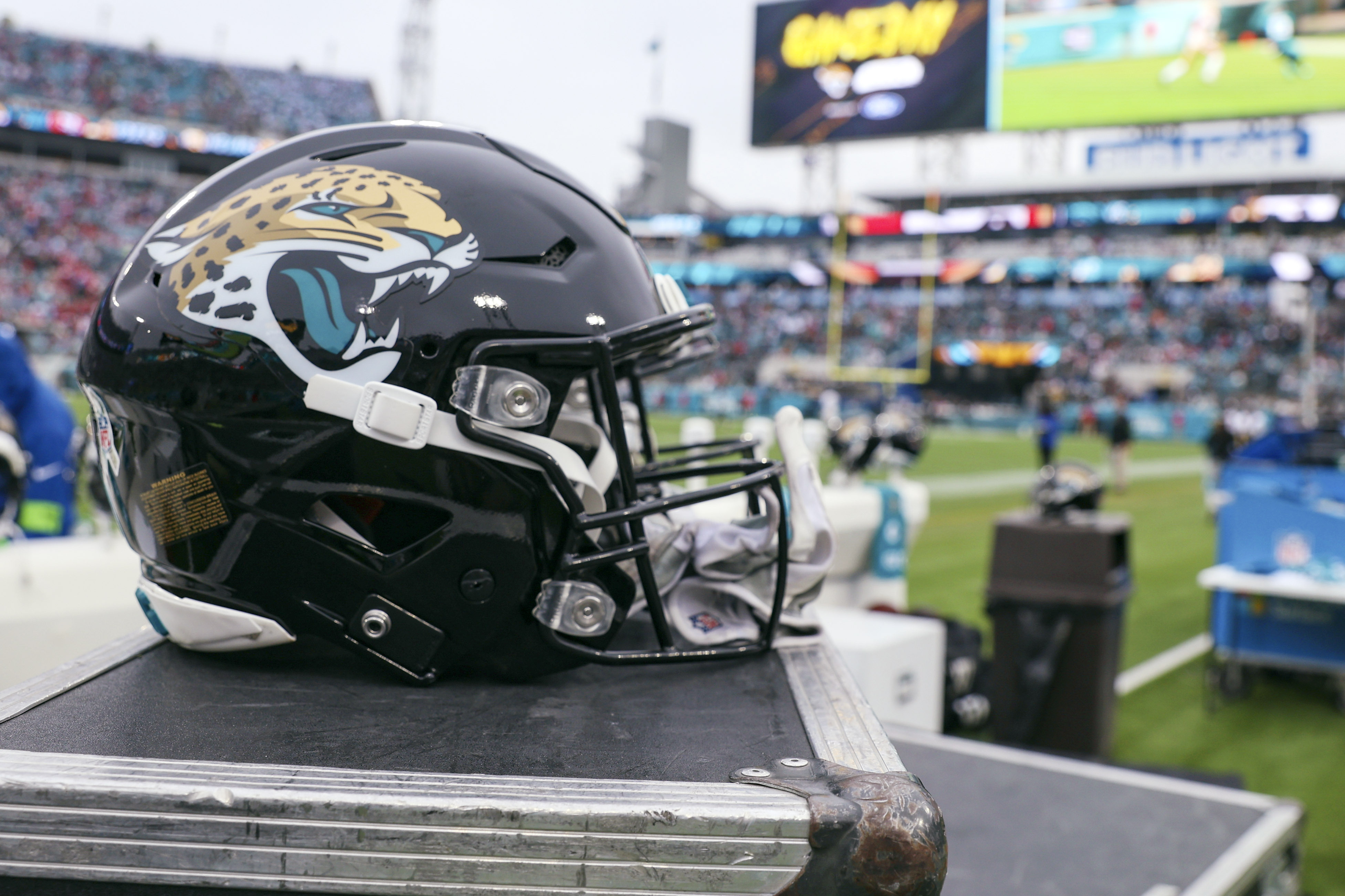 FILE - a Jacksonville Jaguars helmet sits on a box on the sidelines during an NFL football game against the San Francisco 49ers, Sunday, Nov. 12, 2023, in Jacksonville, Fla. The Jaguars have filed a lawsuit against a former employee who is serving prison time after pleading guilty to stealing $22 million from the NFL team's virtual credit card program. 