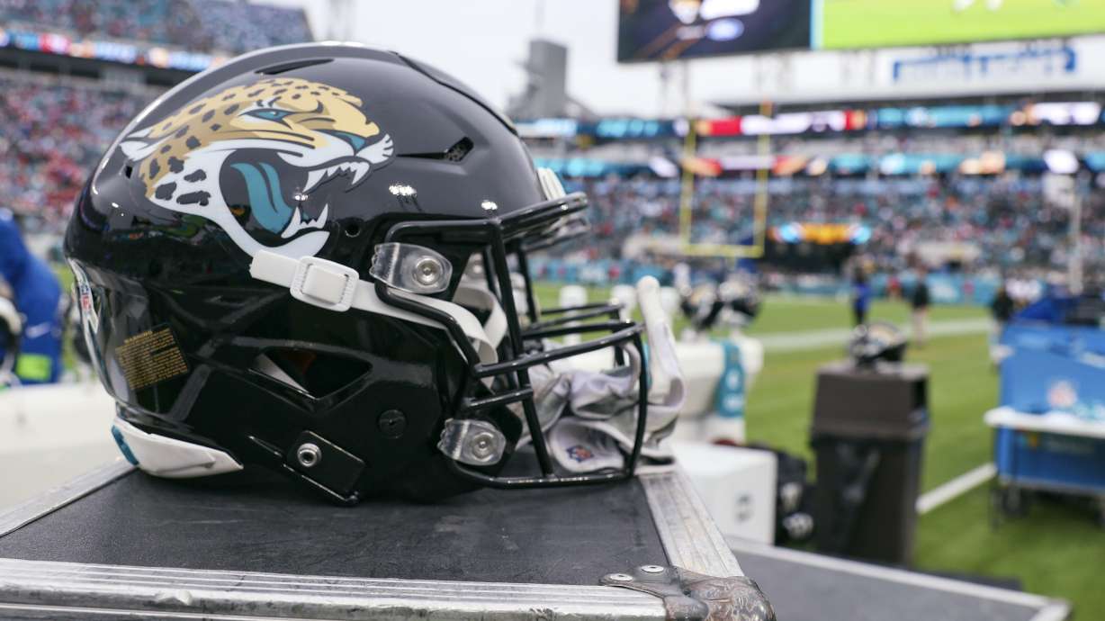FILE - a Jacksonville Jaguars helmet sits on a box on the sidelines during an NFL football game against the San Francisco 49ers, Sunday, Nov. 12, 2023, in Jacksonville, Fla. The Jaguars have filed a lawsuit against a former employee who is serving prison time after pleading guilty to stealing $22 million from the NFL team's virtual credit card program.