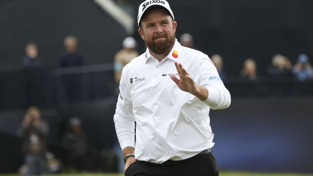 Shane Lowry of Ireland waves as he walks from the 18th green following his second round of the British Open Golf Championships at Royal Troon golf club in Troon, Scotland, Friday, July 19, 2024.