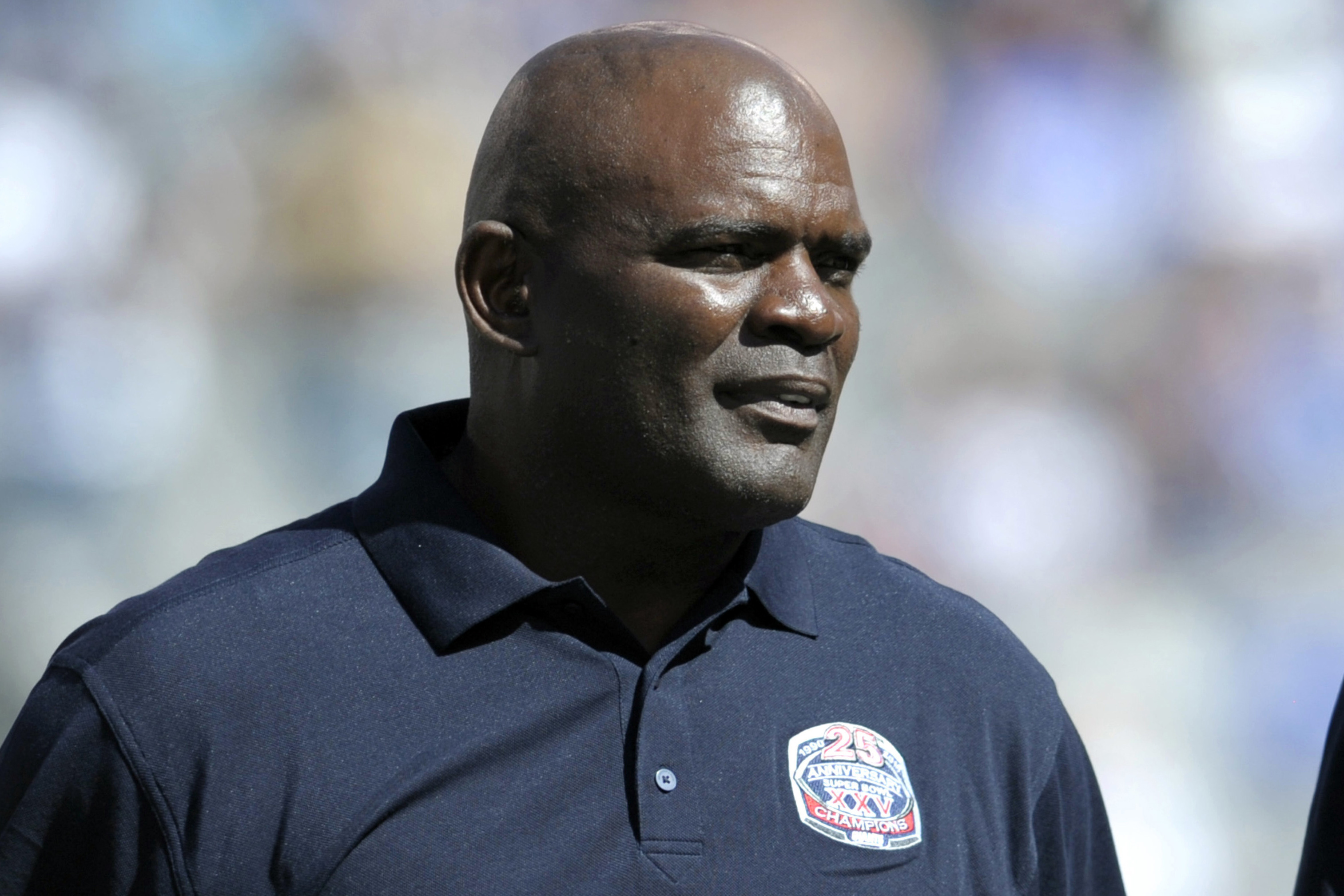 FILE - In this Sept. 20, 2015, photo, former New York Giants' Lawrence Taylor looks on during a 25 year anniversary Super Bowl celebration at halftime of an NFL football game against the Atlanta Falcons in East Rutherford, N.J. Taylor turned himself in at the Broward County Jail in Florida on Wednesday, July 18, 2024 and was released on bail. The reason was his failure to report a residence change as a registered sex offender, the Pembroke Pines Police Department said. 