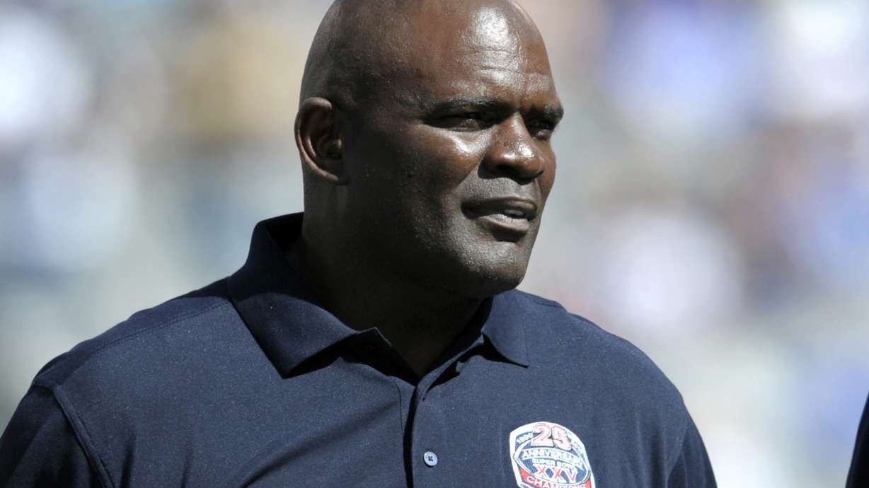 FILE - In this Sept. 20, 2015, photo, former New York Giants' Lawrence Taylor looks on during a 25 year anniversary Super Bowl celebration at halftime of an NFL football game against the Atlanta Falcons in East Rutherford, N.J. Taylor turned himself in at the Broward County Jail in Florida on Wednesday, July 18, 2024 and was released on bail. The reason was his failure to report a residence change as a registered sex offender, the Pembroke Pines Police Department said.