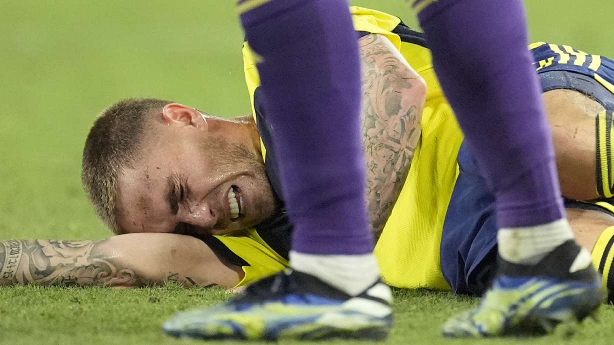 Nashville SC midfielder Tyler Boyd lies on the field injured during the second half of an MLS soccer match against Orlando City, Wednesday, July 17, 2024, in Nashville, Tenn. Orlando City won 3-0.