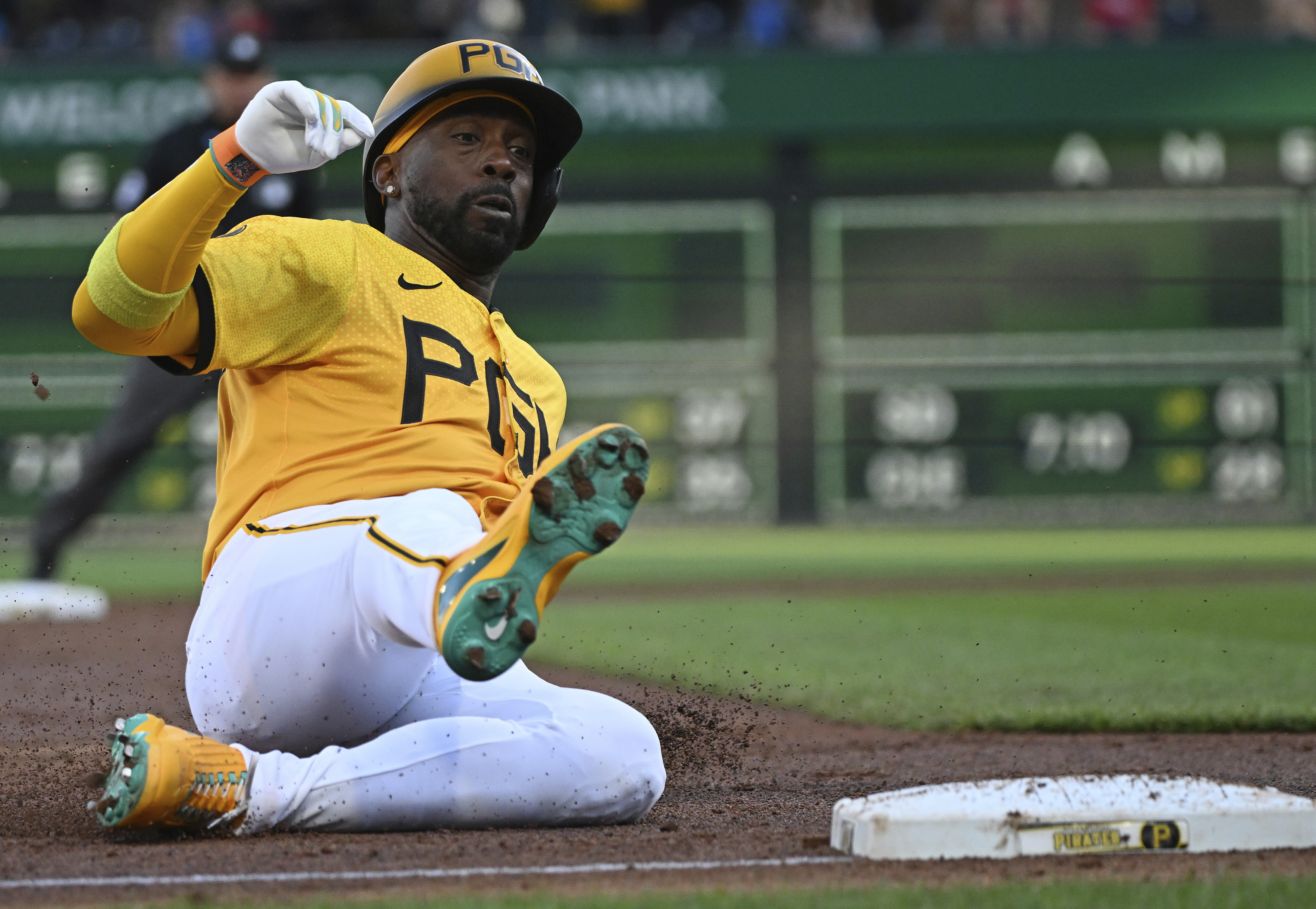 Pittsburgh Pirates' Andrew McCutchen slides in safely to third base in the first inning of a baseball game against the Philadelphia Phillies in Pittsburgh, Friday, July 19, 2024. 
