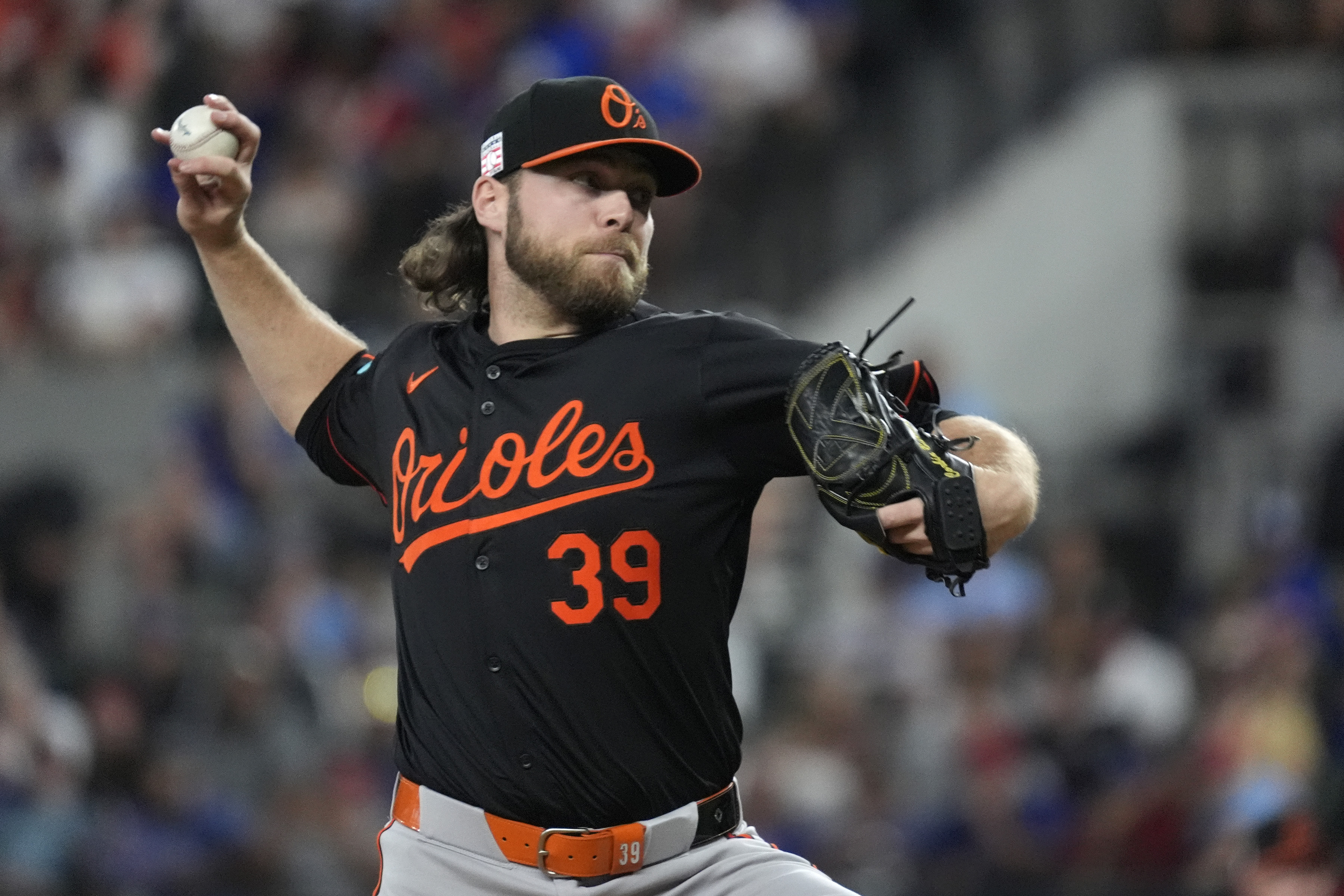 Baltimore Orioles starting pitcher Corbin Burnes throws during the first inning of a baseball game against the Texas Rangers in Arlington, Texas, Friday, July 19, 2024. 