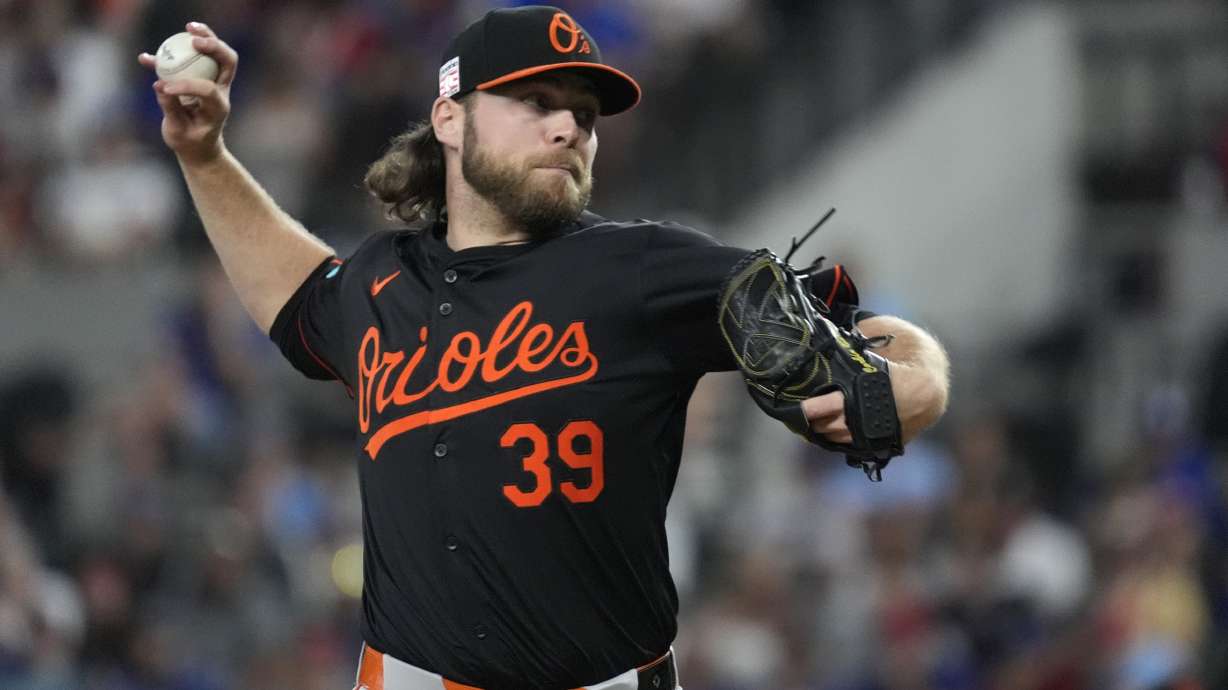 Baltimore Orioles starting pitcher Corbin Burnes throws during the first inning of a baseball game against the Texas Rangers in Arlington, Texas, Friday, July 19, 2024.