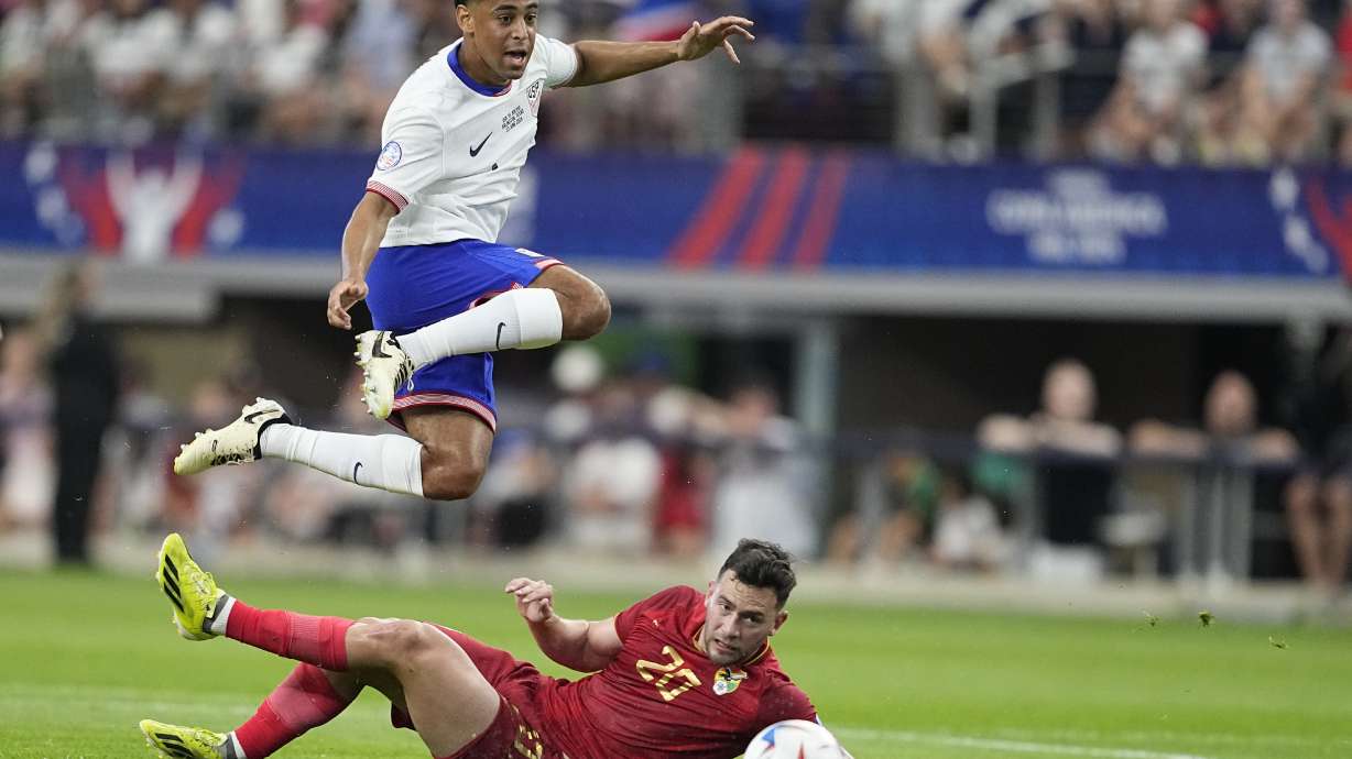 Tyler Adams of the United States jumps over Bolivia's Fernando Saucedo during a Copa America Group C soccer match in Arlington, Texas, Sunday, June 23, 2024.