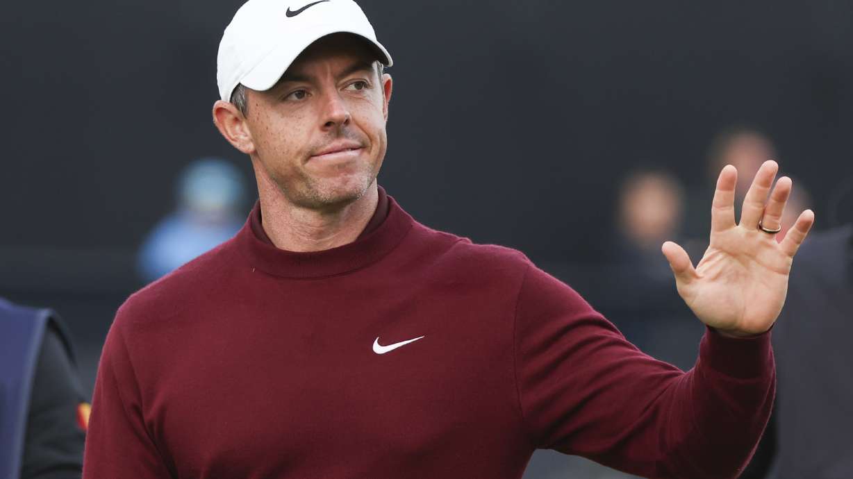 Rory McIlroy of Northern Ireland waves as he walks off the 18th green following his second round of the British Open Golf Championships at Royal Troon golf club in Troon, Scotland, Friday, July 19, 2024.