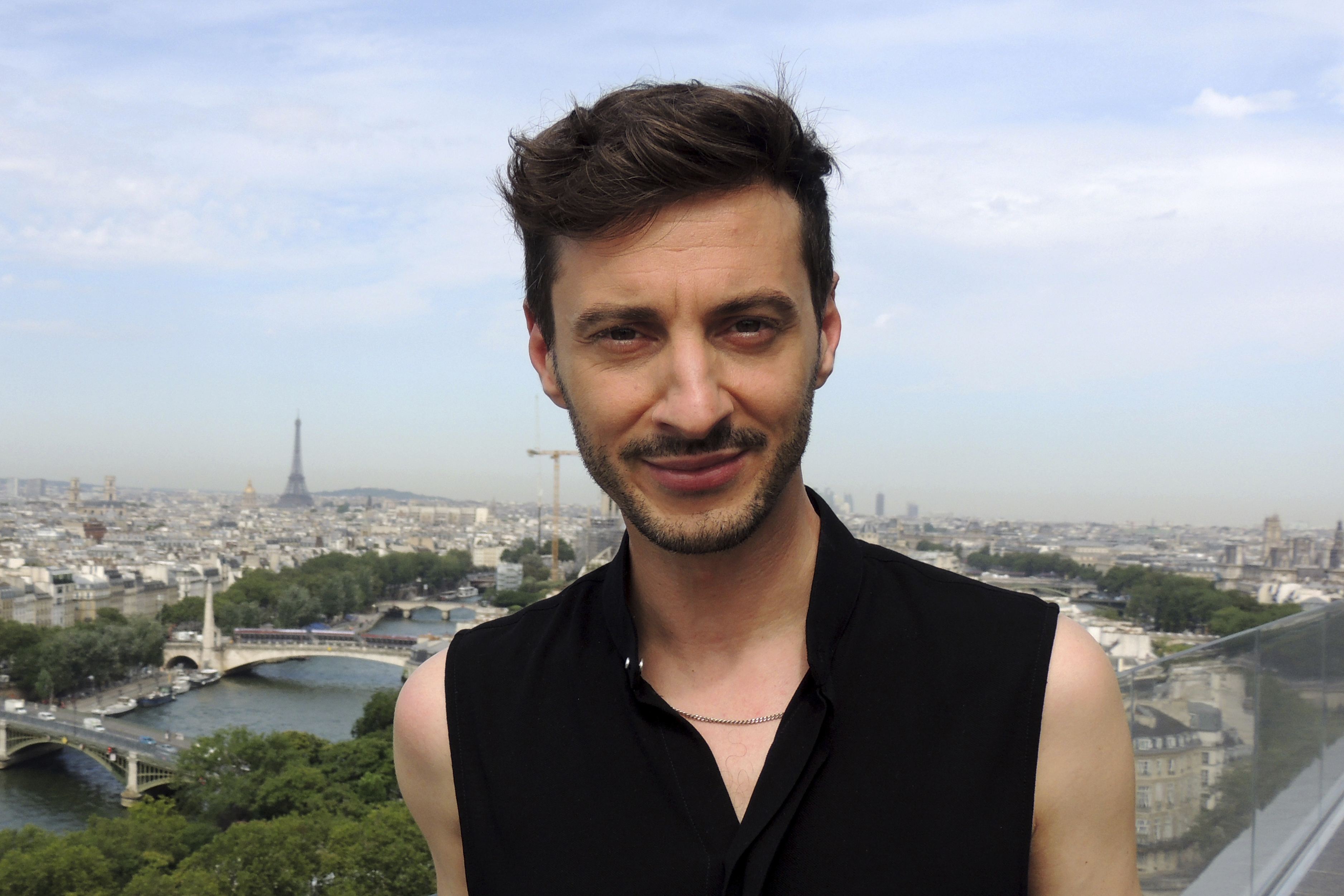 Thomas Jolly poses Friday, July 19, 2024 in Paris. Thomas Jolly, a 40-year-old actor and stage director, was chosen by the Paris 2024 Organizing Committee to helm the artistic direction of the four grand ceremonies. He will be tasked with bringing to life Paris' ambitious plan to hold the July 26, 2024, opening ceremony in the French capital's city center, along the Seine River. 