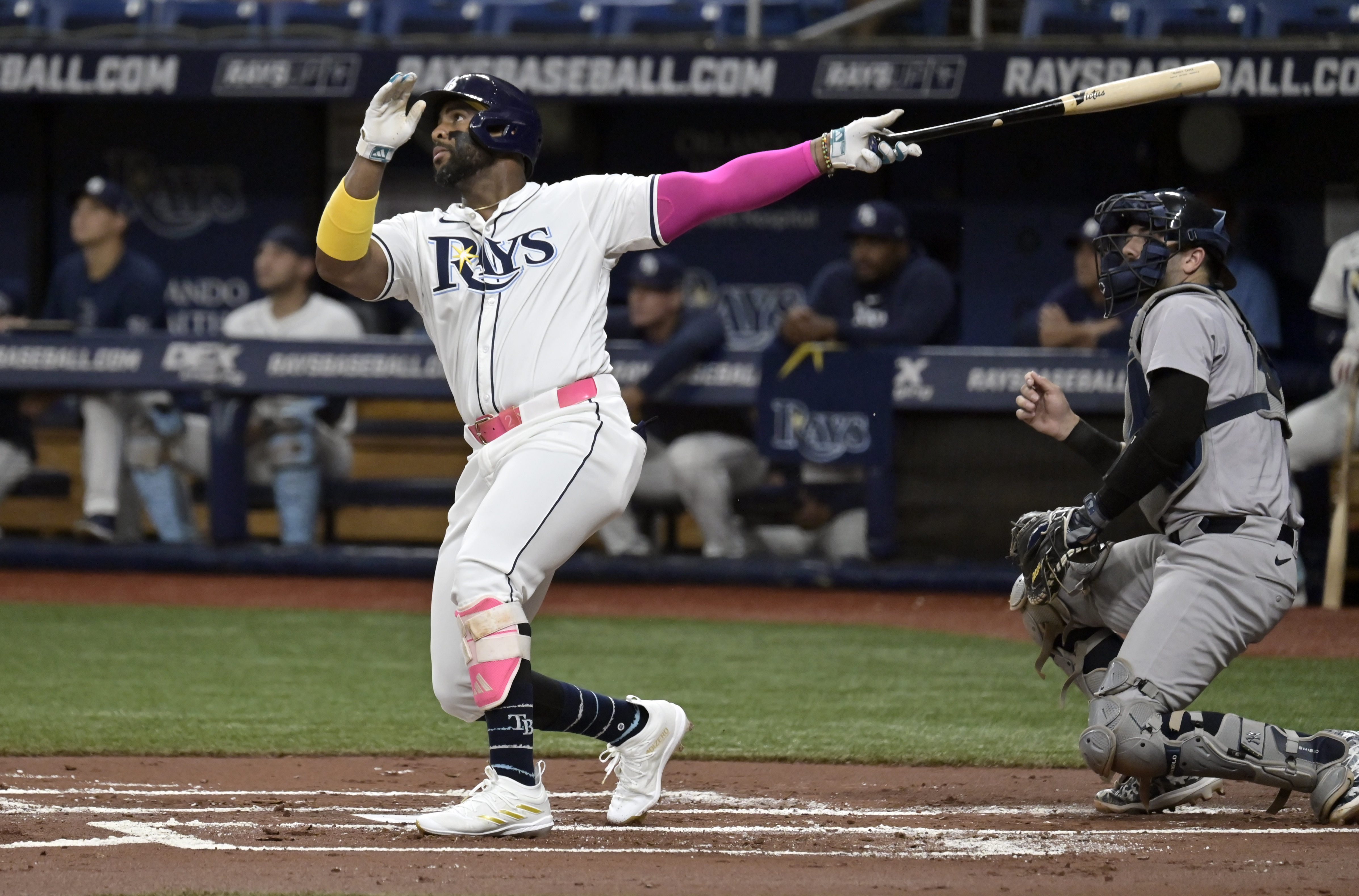 New York Yankees catcher Austin Wells, right, watches as Tampa Bay Rays' Yandy Díaz hits a fly ball off the catwalk in center field during the first inning of a baseball game Thursday, July 11, 2024, in St. Petersburg, Fla. 