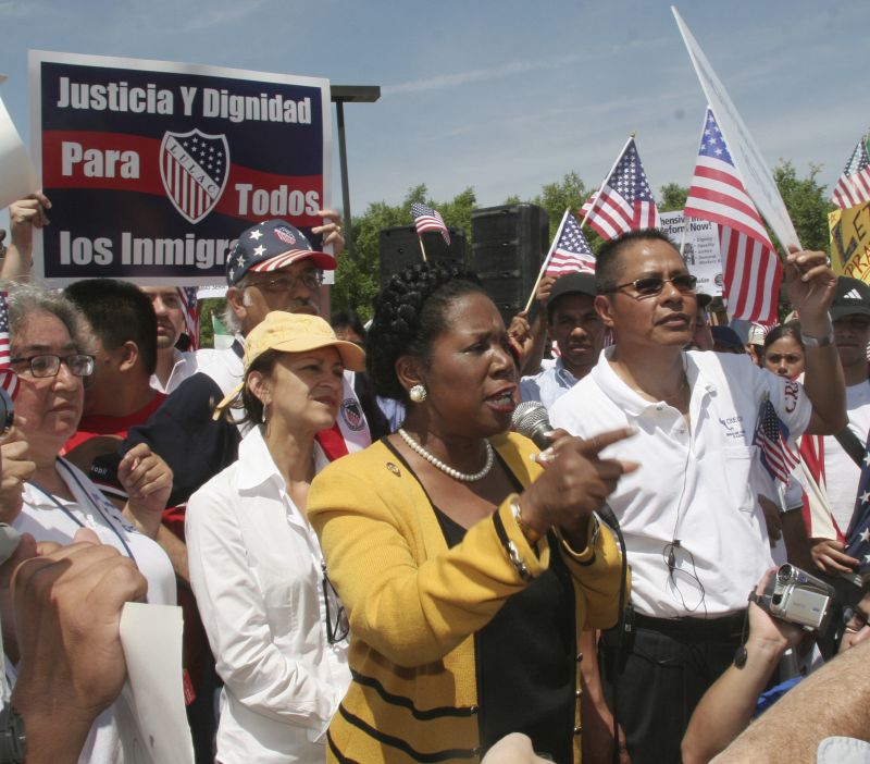 Rep. Sheila Jackson Lee, center, D-Texas, speaks during an immigration rally in Guadalupe Plaza in Houston, Texas, April 10, 2006.