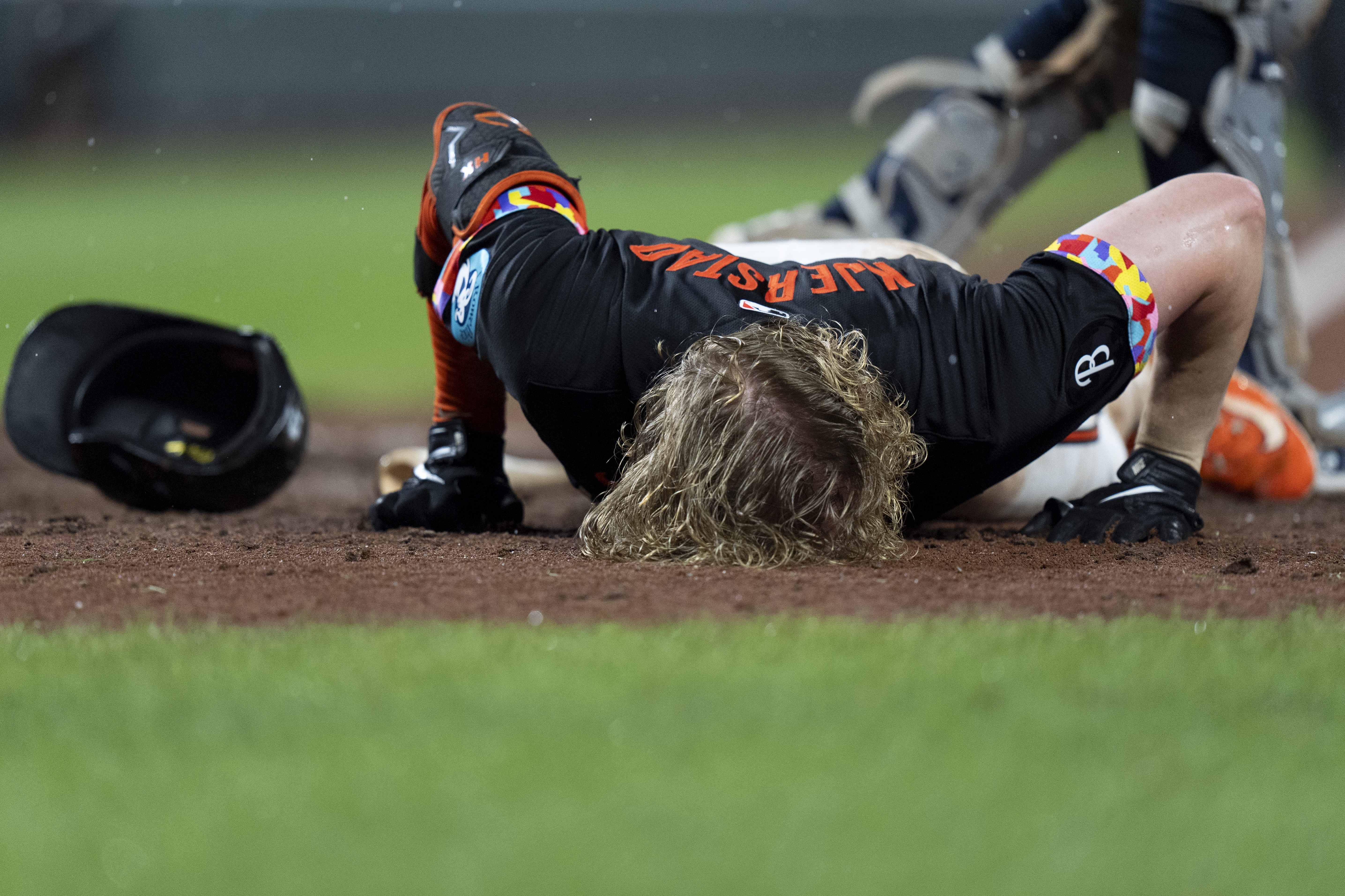 Baltimore Orioles' Heston Kjerstad reacts after being hit by a pitch from New York Yankees relief pitcher Clay Holmes during the ninth inning of a baseball game, Friday, July 12, 2024, in Baltimore.