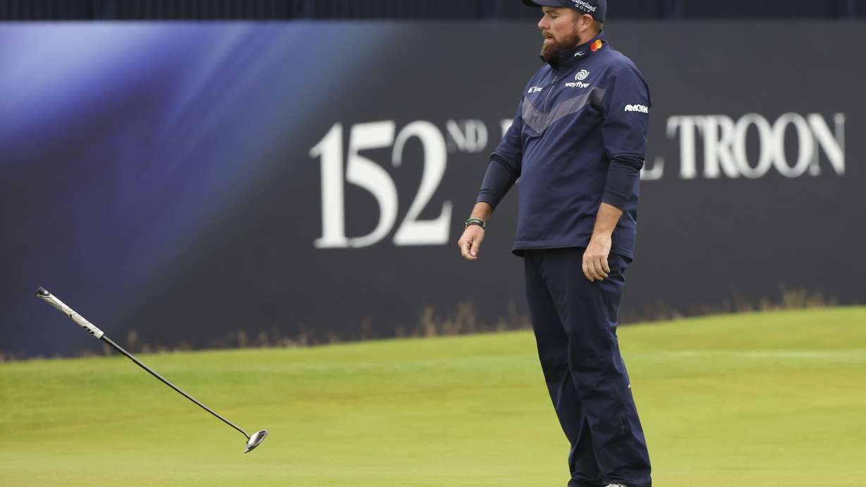 Shane Lowry of Ireland drops his putter on the 18th green during his third round of the British Open Golf Championships at Royal Troon golf club in Troon, Scotland, Saturday, July 20, 2024.