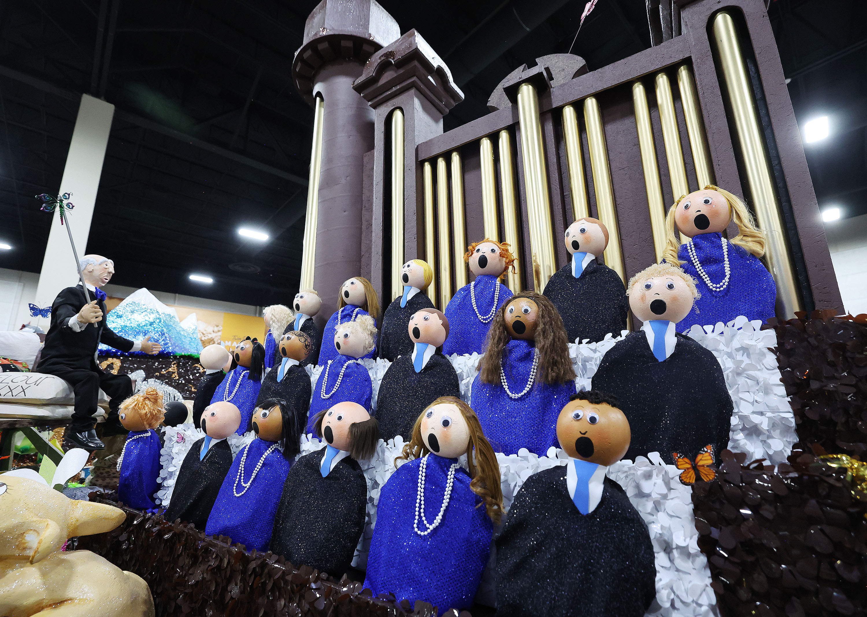 The public looks over the South Jordan Country Crossing Stake float and other Days of '47 Parade floats during a preview at the Mountain America Expo Center in Sandy on Saturday.