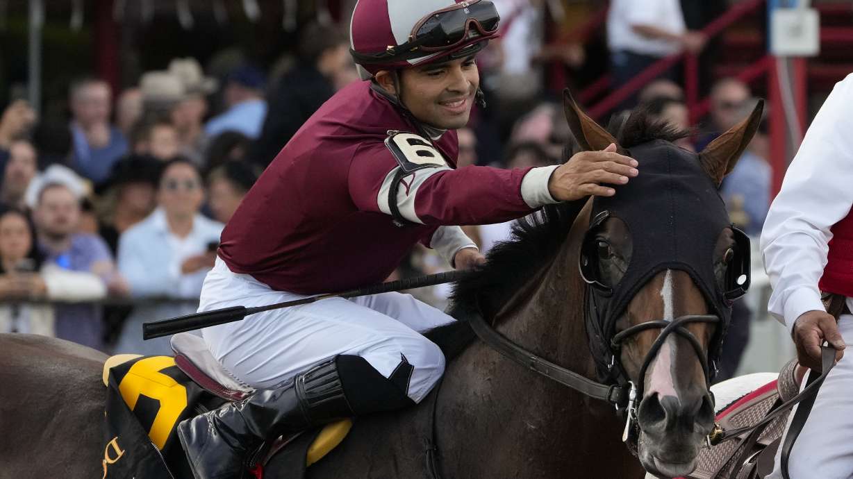 FILE - Jockey Luis Saez congratulates Dornoch (6) after winning the 156th running of the Belmont Stakes horse race, Saturday, June 8, 2024, in Saratoga Springs, N.Y.