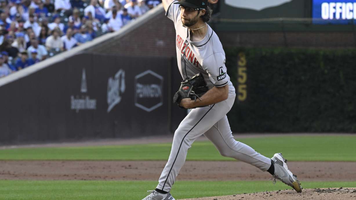 Arizona Diamondbacks pitcher Zac Gallen delivers during the first inning of a baseball game against the Chicago Cubs, Saturday, July 20, 2024, in Chicago.