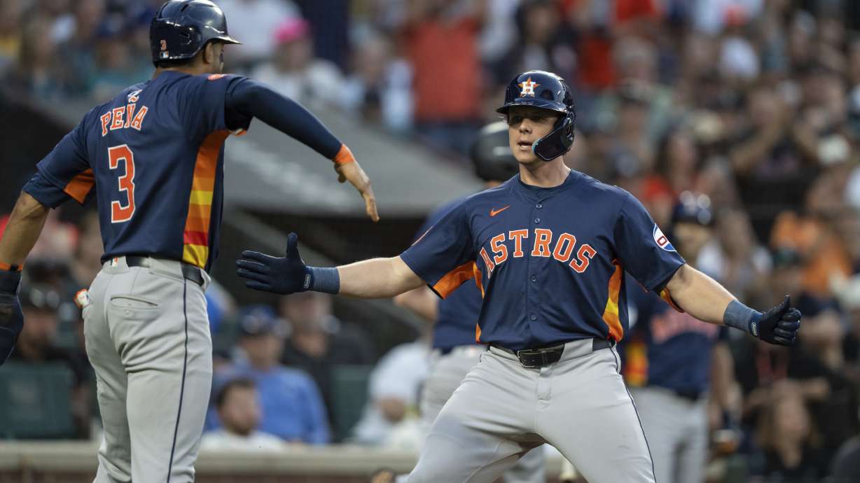 Houston Astros' Jake Meyers, right, celebrates with Jeremy Pena after hitting a two-run home run during the seventh inning of a baseball game against the Seattle Mariners, Saturday, July 20, 2024, in Seattle.