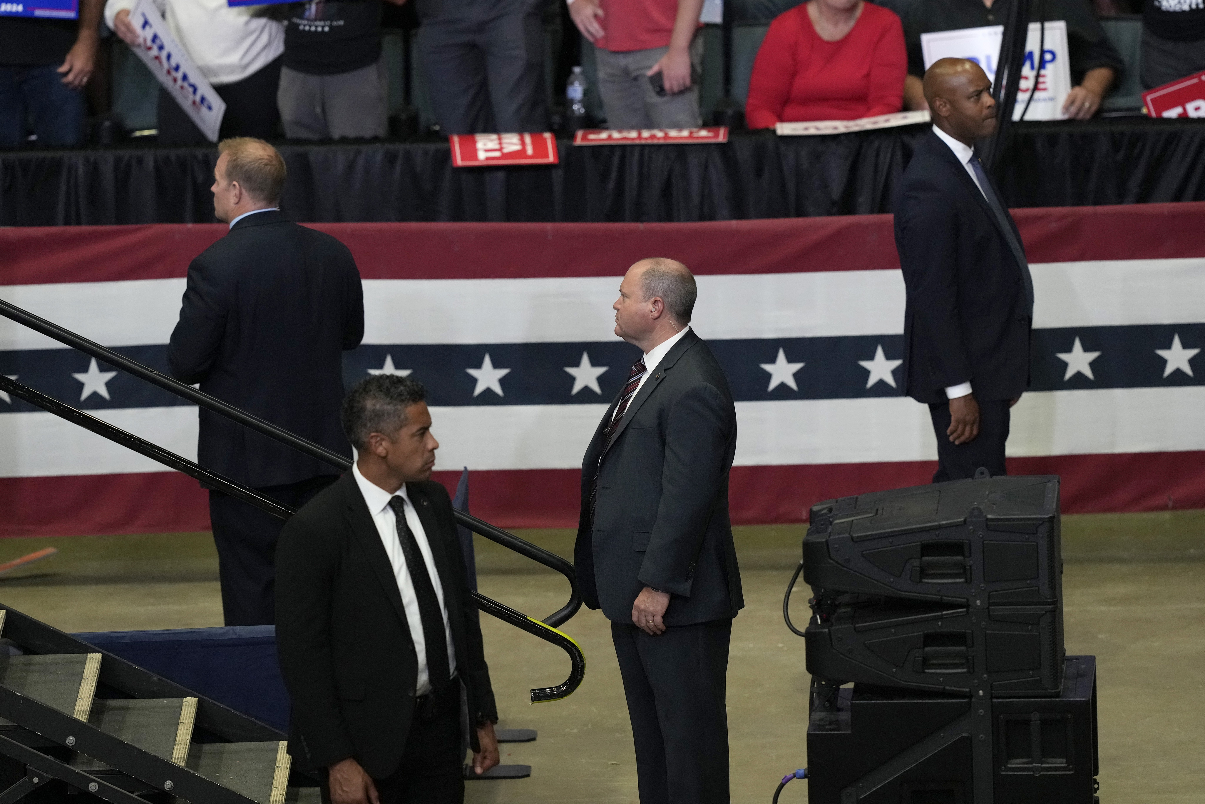 Members of the U.S. Secret Service look on as Republican presidential candidate former President Donald Trump speaks at a campaign event with Republican vice presidential candidate Sen. JD Vance, R-Ohio, Saturday, at Van Andel Arena in Grand Rapids, Mich.