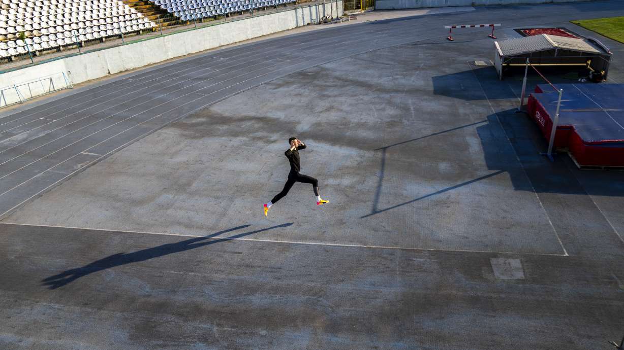 High jumper Oleh Doroshchuk works out during a training session at Zirka stadium, in Kropyvnytskyi, Ukraine, Friday, April 19, 2024.