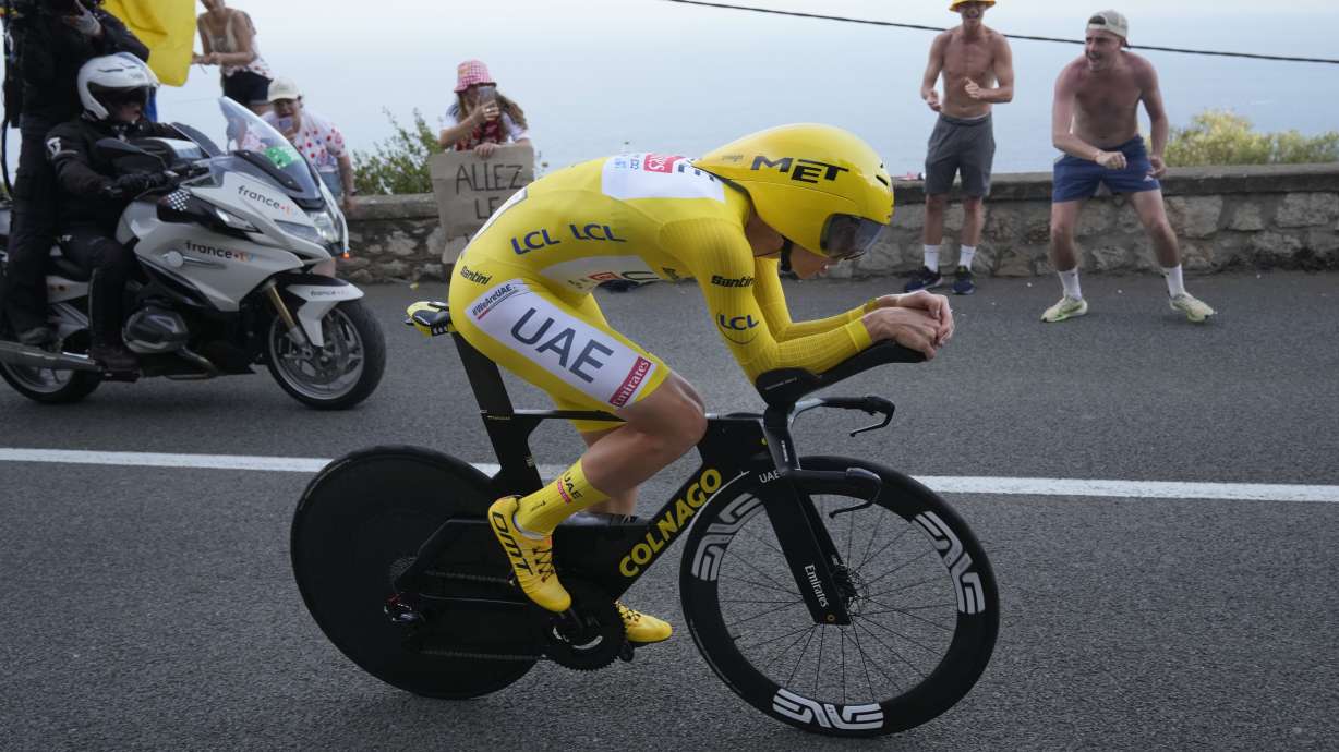 Slovenia's Tadej Pogacar, wearing the overall leader's yellow jersey, rides during the twenty-first stage of the Tour de France cycling race, an individual time trial over 33.7 kilometers (20.9 miles) with start in Monaco and finish in Nice, France, Sunday, July 21, 2024.