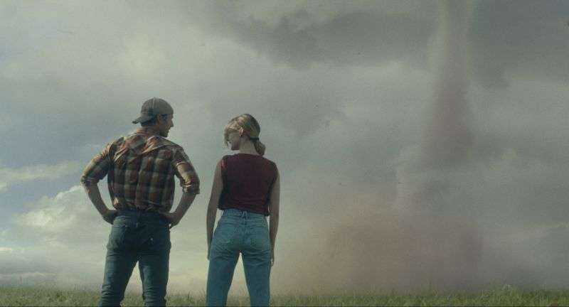 This image released by Universal Pictures shows Glen Powell, left, and Daisy Edgar-Jones in a scene from "Twisters."