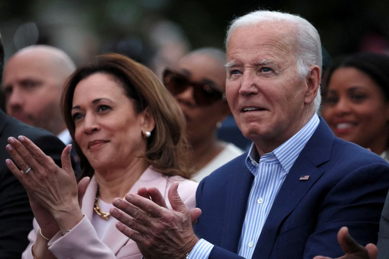 President Joe Biden claps hands next to Vice President Kamala Harris on the South Lawn at the White House in Washington, D.C., on June 10. Biden dropped his reelection campaign Sunday.