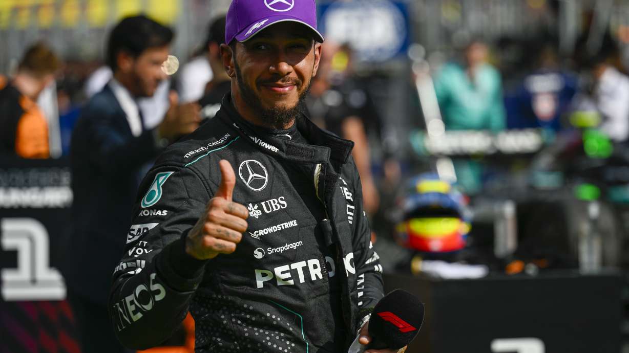 Mercedes driver Lewis Hamilton of Britain celebrates his third place at the Hungarian Formula One Grand Prix race at the Hungaroring racetrack in Mogyorod, Hungary, Sunday, July 21, 2024.