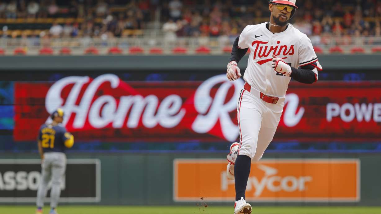 Minnesota Twins' Byron Buxton runs the bases on his solo home run against the Milwaukee Brewers in the third inning of a baseball game, Sunday, July 21, 2024, in Minneapolis.