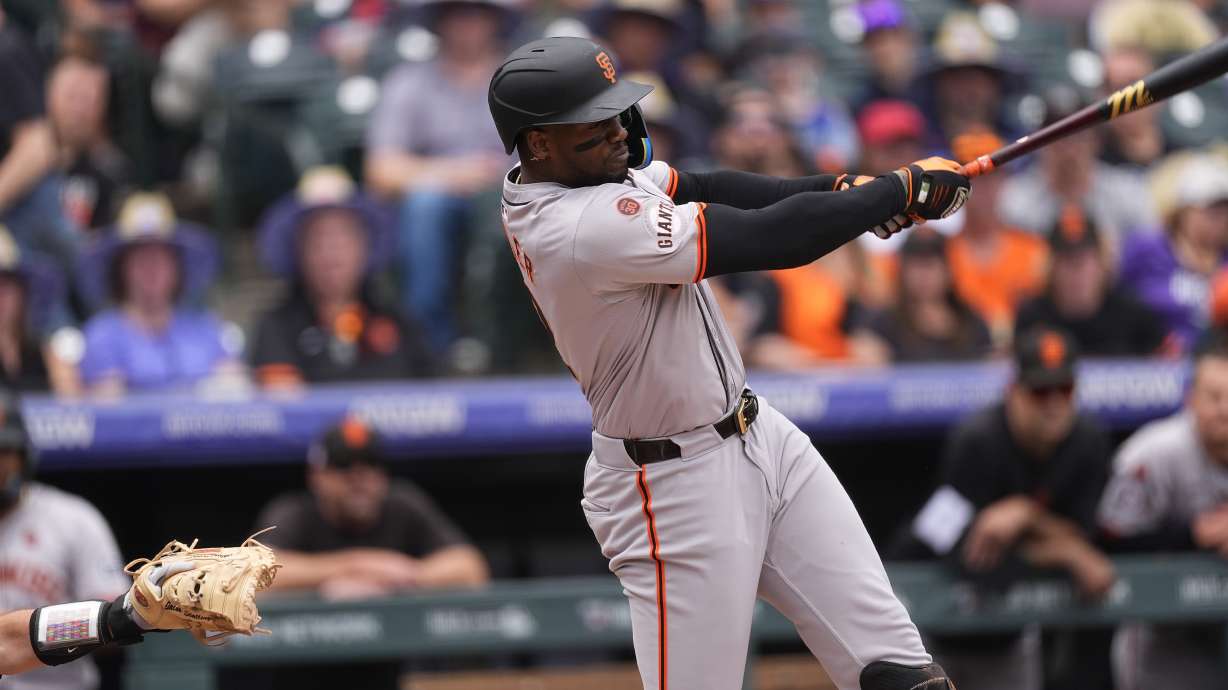 San Francisco Giants' Jorge Soler connects for a solo home run off Colorado Rockies starting pitcher Ryan Feltner in the first inning of a baseball game, Sunday, July 21, 2024, in Denver.