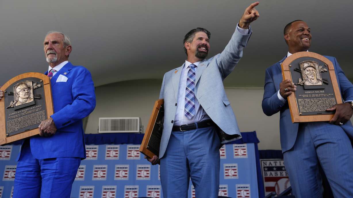 Baseball Hall of Fame inductees Jim Leyland, left, Todd Helton, center, and Adrián Beltré, right, holds their plaques at the National Baseball Hall of Fame induction ceremony, Sunday, July 21, 2024, in Cooperstown, N.Y.