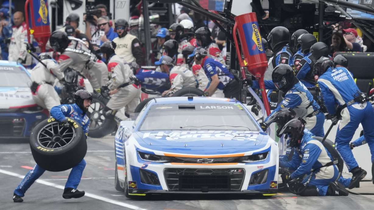 Kyle Larson makes a pit stop during a NASCAR Cup Series auto race at Indianapolis Motor Speedway, Sunday, July 21, 2024, in Indianapolis.