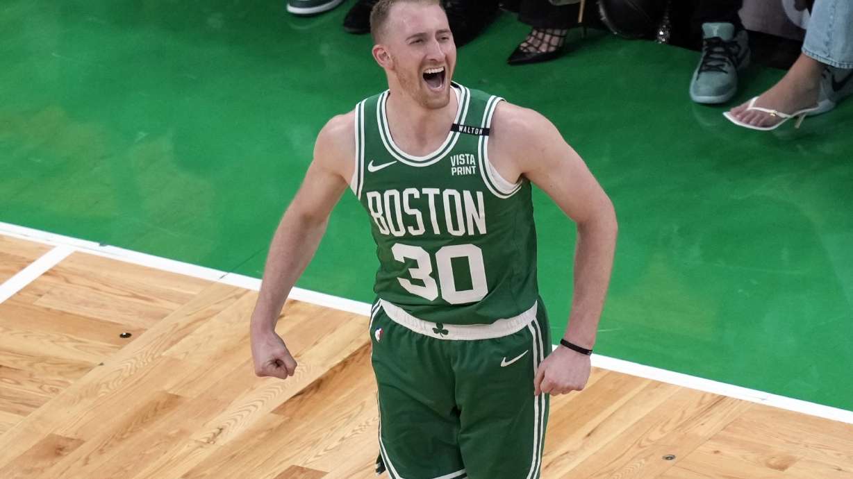 FILE - Boston Celtics' Sam Hauser reacts after making a 3-point basket during the first half of Game 5 of the NBA basketball finals against the Dallas Mavericks, June 17, 2024, in Boston. The Boston Celtics locked up another member of their championship core on Sunday, July 21, agreeing to a four-year, $45 million extension with Hauser, a person with knowledge of the details said.