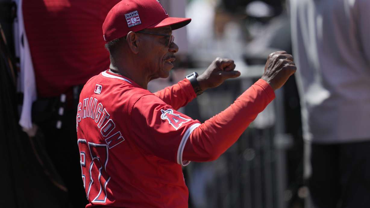 Los Angeles Angels manager Ron Washington gestures toward players during the seventh inning of a baseball game against the Oakland Athletics in Oakland, Calif., Saturday, July 20, 2024.