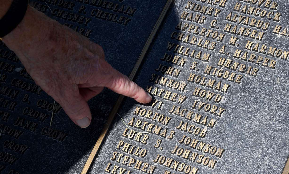 Ellis Ivory, executive director of This Is the Place Heritage Park in Salt Lake City, points out his great grandfather Mathew Ivory’s name on the list of the first company to arrive in the Salt Lake Valley. This photo was taken at the park on July 9.